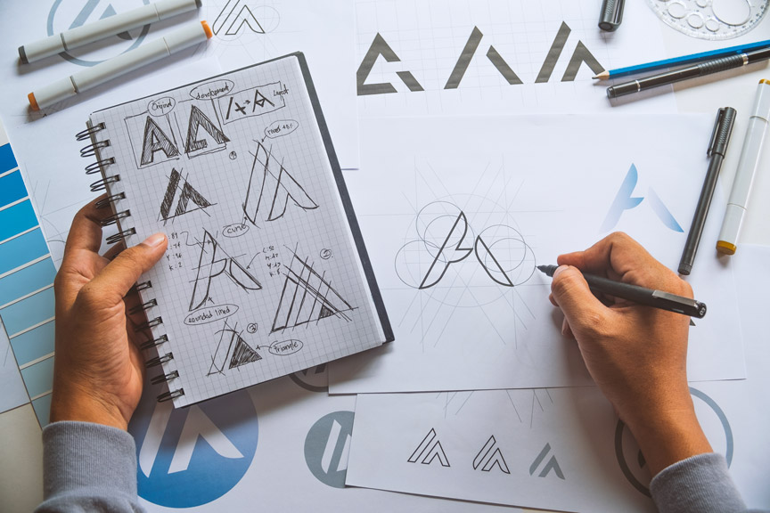 Person Sketching A Dental Logo