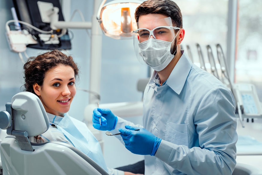 Dentist Examining A Patient