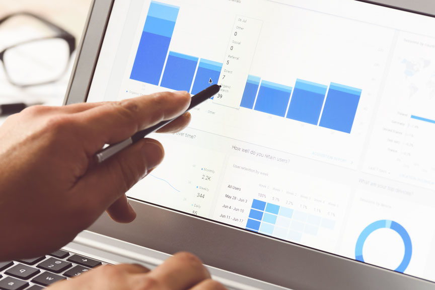 Hand Pointing At A Chart On A Tablet