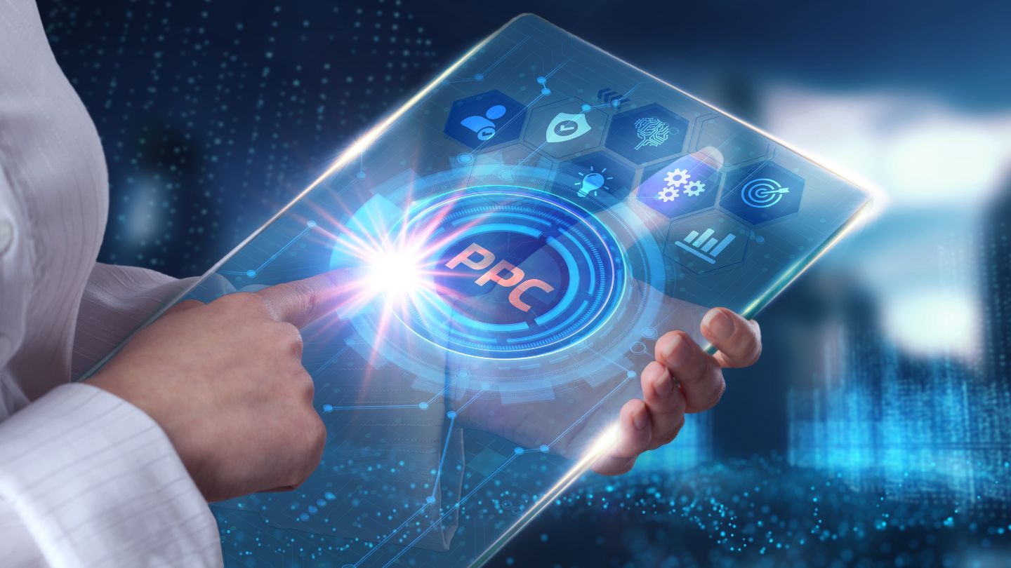 Person Touching A Transparent Tablet With A PPC Icon