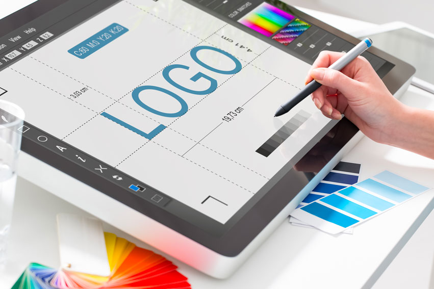 Person Designing A Logo On A Tablet