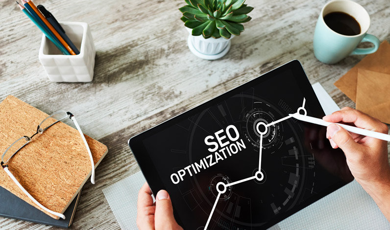 Person Optimizing SEO On Tablet
