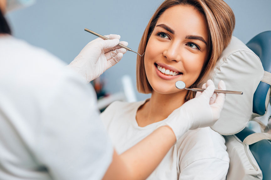 Dentist Examining A Patient