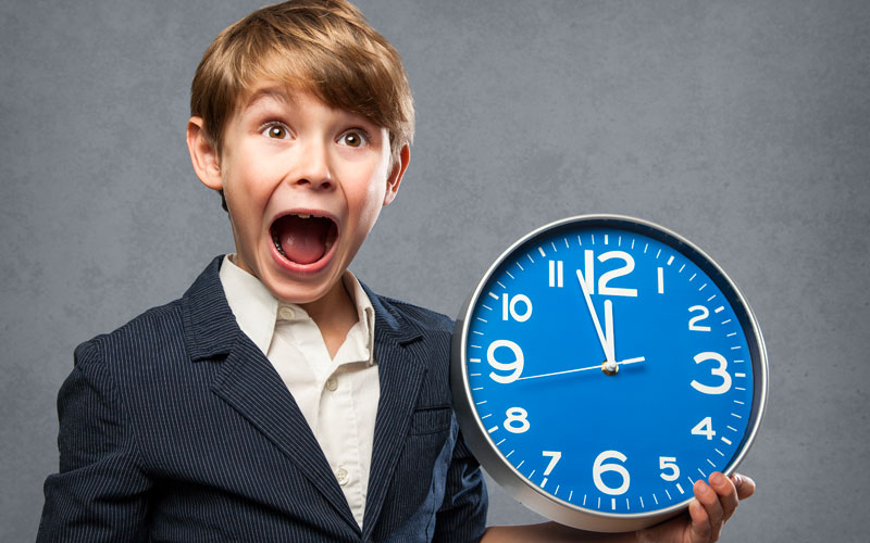 Shocked Boy Holding A Clock